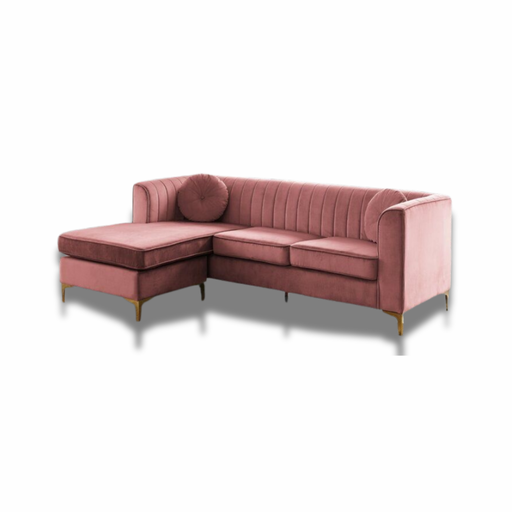 Blush pink velvet L-shaped sofa with channel tufting, bolster cushion and gold legs